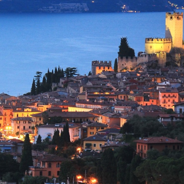 View of Malcesine's Scaligero Castle and harbour on Lake Garda with Monte Baldo in the background